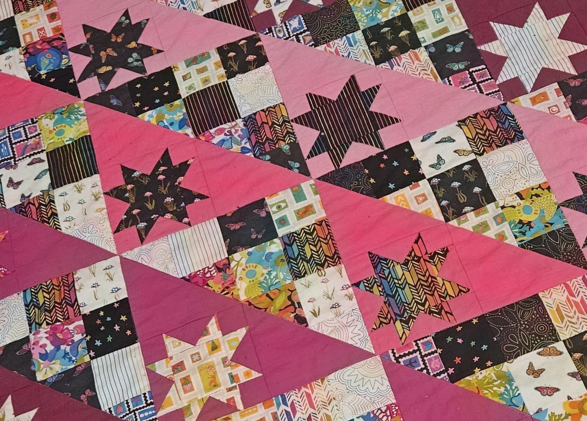 Vibrant quilt featuring star shapes